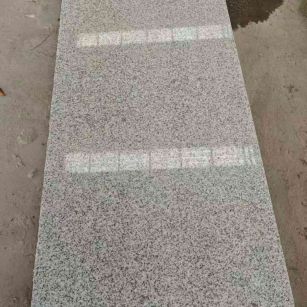 钦州芝麻白光面毛板